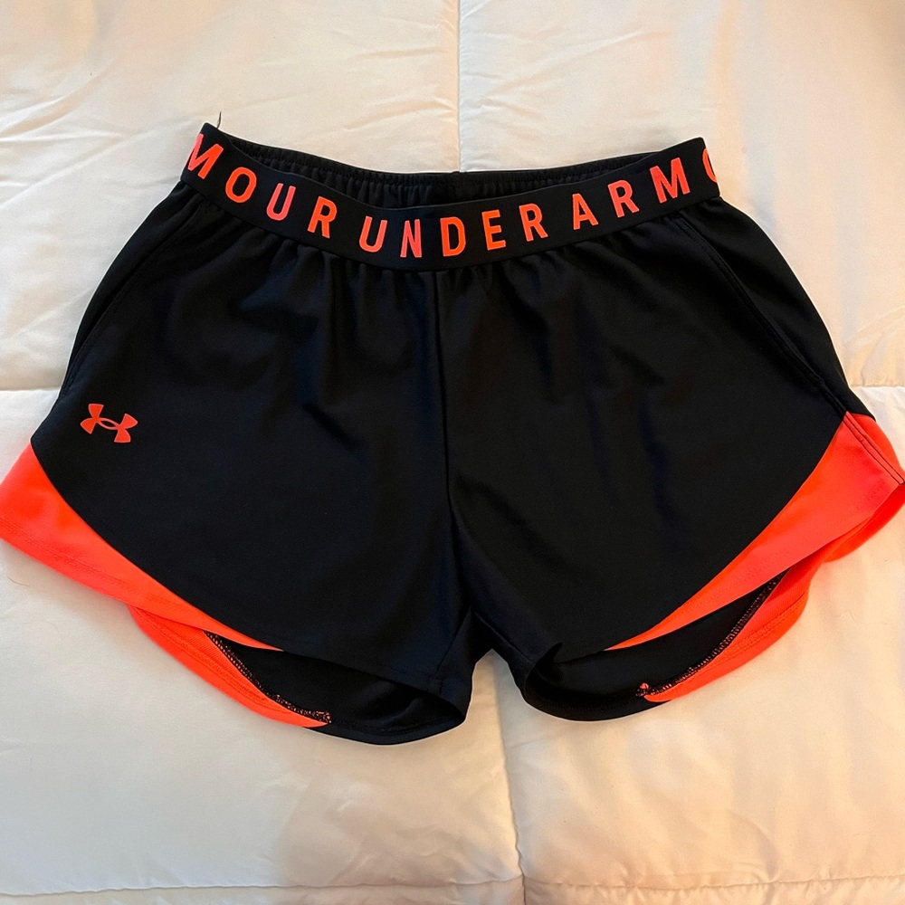 Under Armour, small women’s athletic shorts. Coral details.